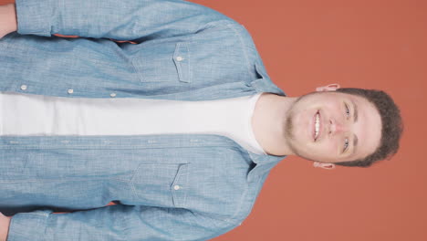 Vertical-video-of-Man-smiling-at-camera